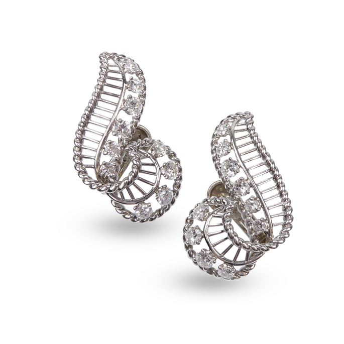   Cartier - Pair of diamond and wirework scroll earrings of stylised treble clef form | MasterArt